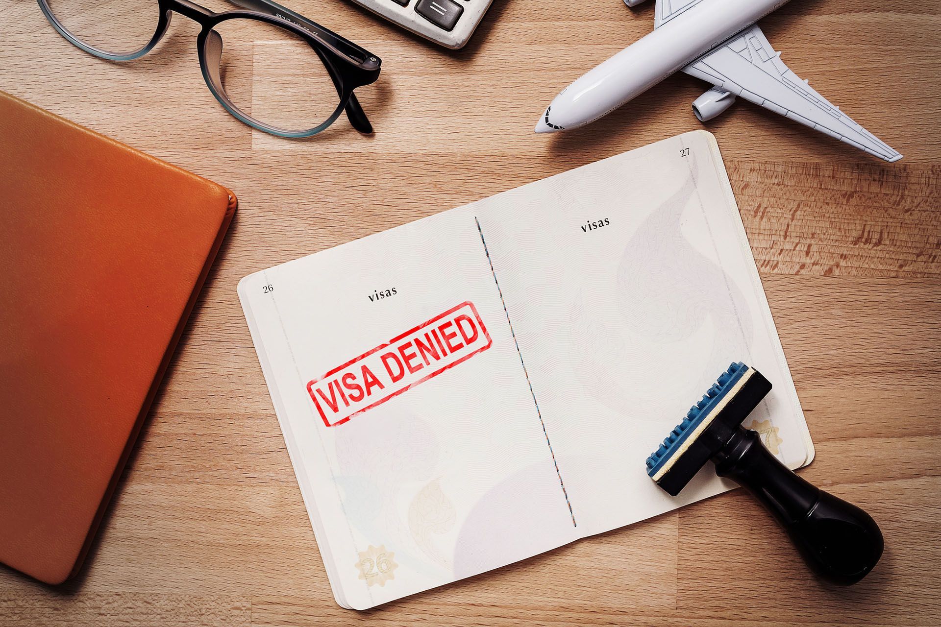 a passport with a stamp on it that says visa denied