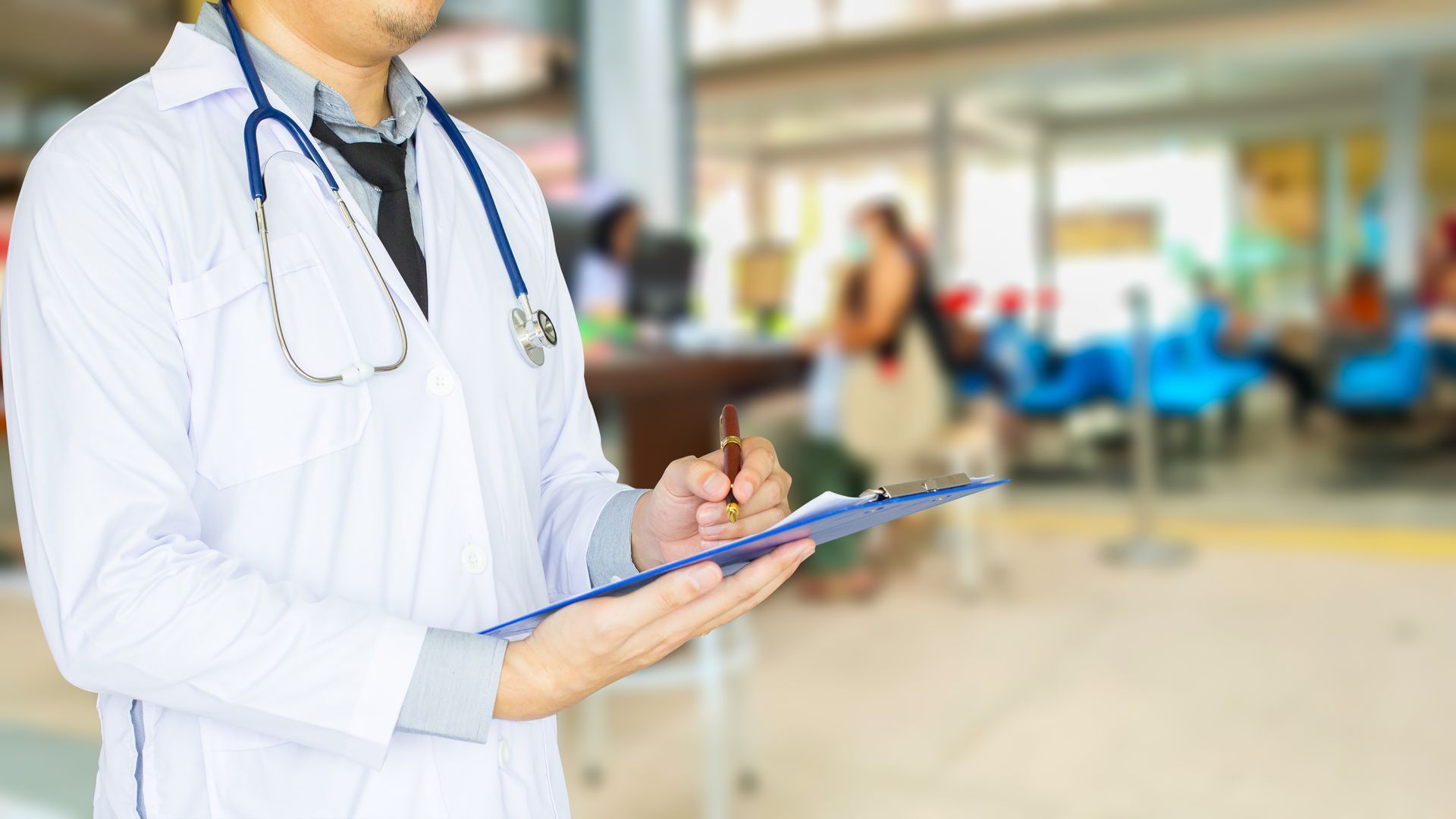 Urgent care provider examining a patient at a walk-in clinic. Urgent care provider examining a patient at a walk-in clinic.