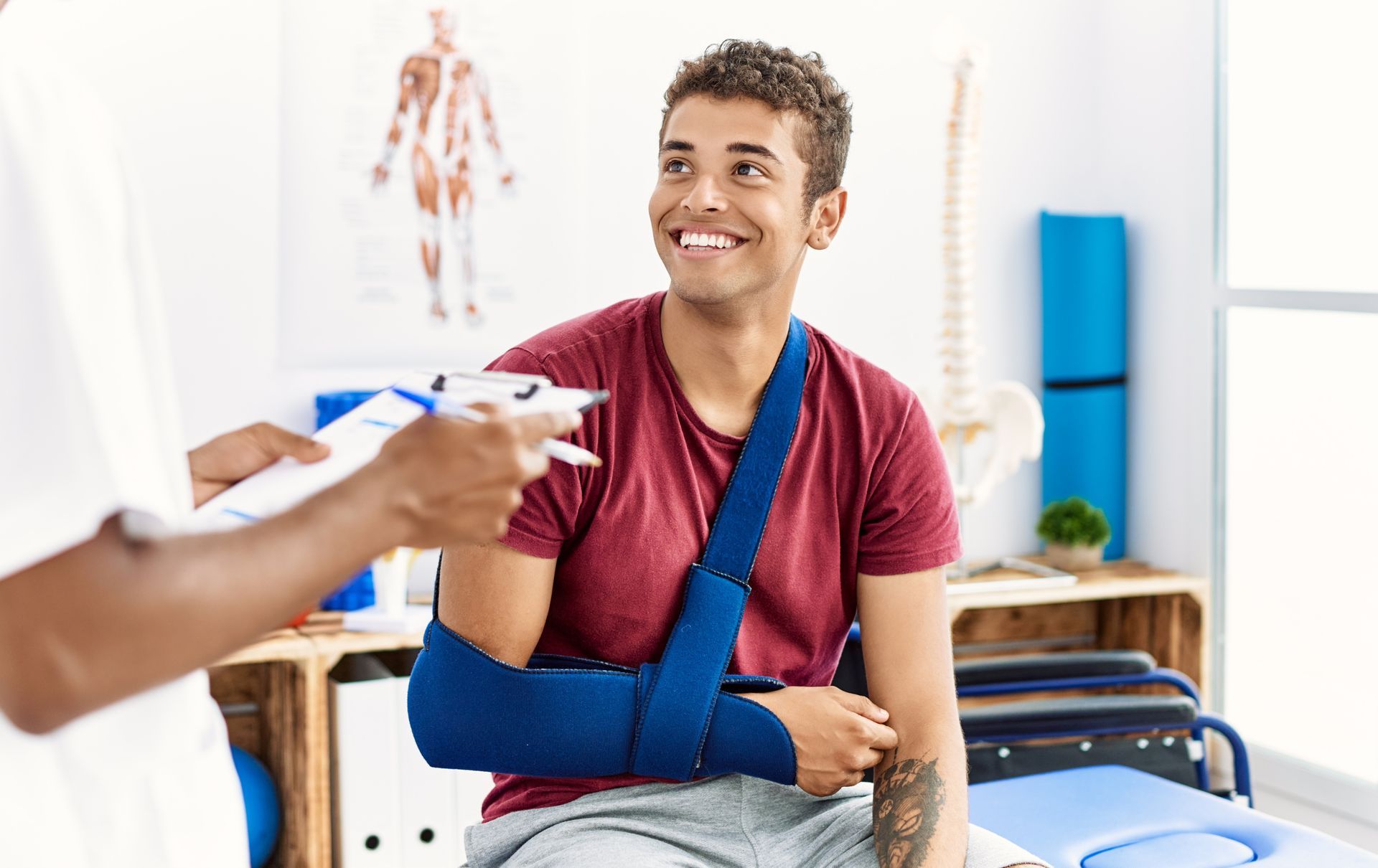 Young man with a blue arm brace