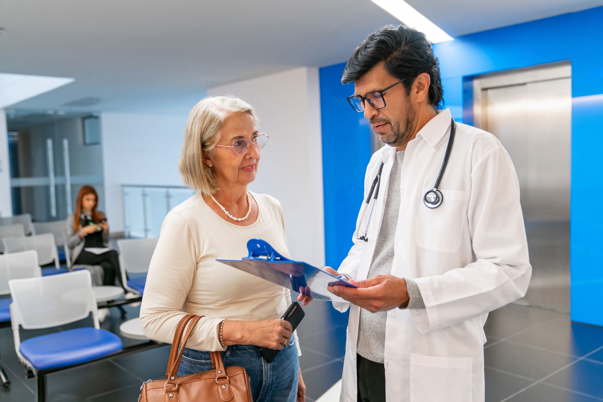 A doctor consults with a patient at West Ocean City Injury & Illness Center, a walk-in clinic in Sno