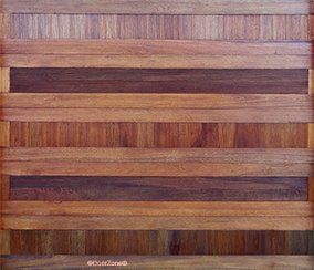 Wooden panel with horizontal stripes in varied brown tones, resembling a textured wall or floor pattern.