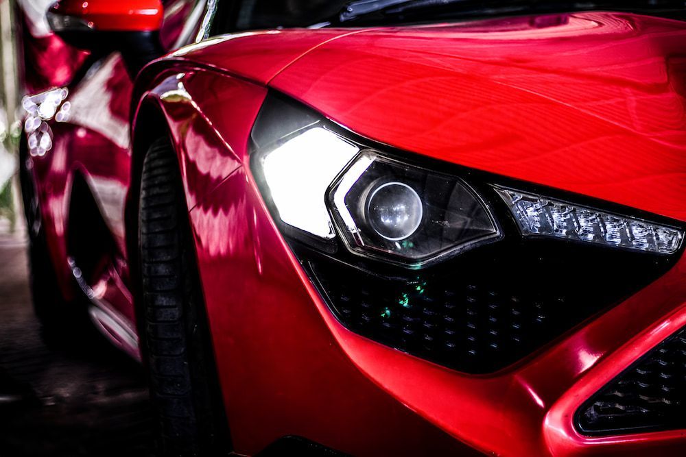 A Close Up Of A Red Sports Car's Headlight — Hunter Automotive In Bungalow, QLD