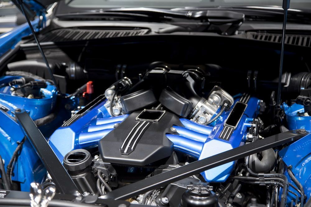 The Engine Of A Blue Car Is Shown With The Hood Open — Hunter Automotive In Atherton, QLD