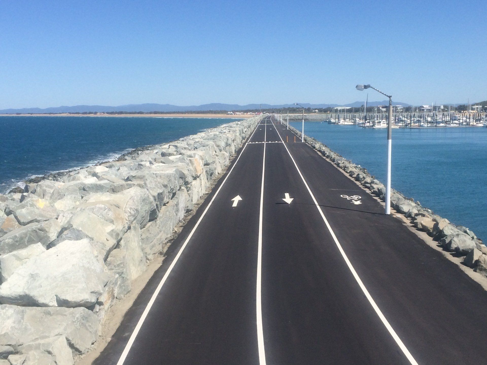 Paved Road With White Lines, Lampposts, and a White Vehicle — CJD Investments (NQ) Pty Ltd in Mackay Harbour, QLD