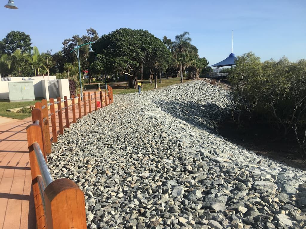 Two Construction Workers in Yellow Vests and Hard Hats Working — CJD Investments (NQ) Pty Ltd in Mackay Harbour, QLD