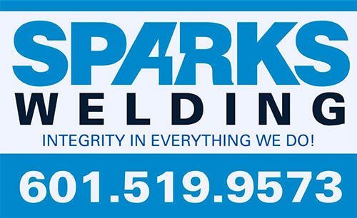 Business sign for Sparks Welding featuring their phone number, 601-519-9573, and slogan "Integrity in everything we do!"
