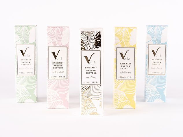 Five pastel skincare boxes in mint, pink, cream, yellow, and blue with gold botanical patterns