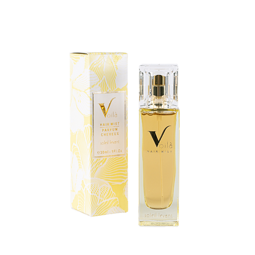 Gold perfume bottle and matching box with a large black V on a white background