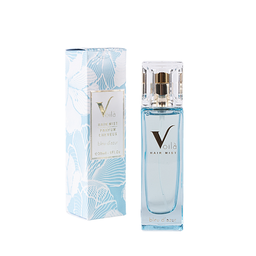 Blue-and-white perfume bottle beside its matching patterned box on a white background