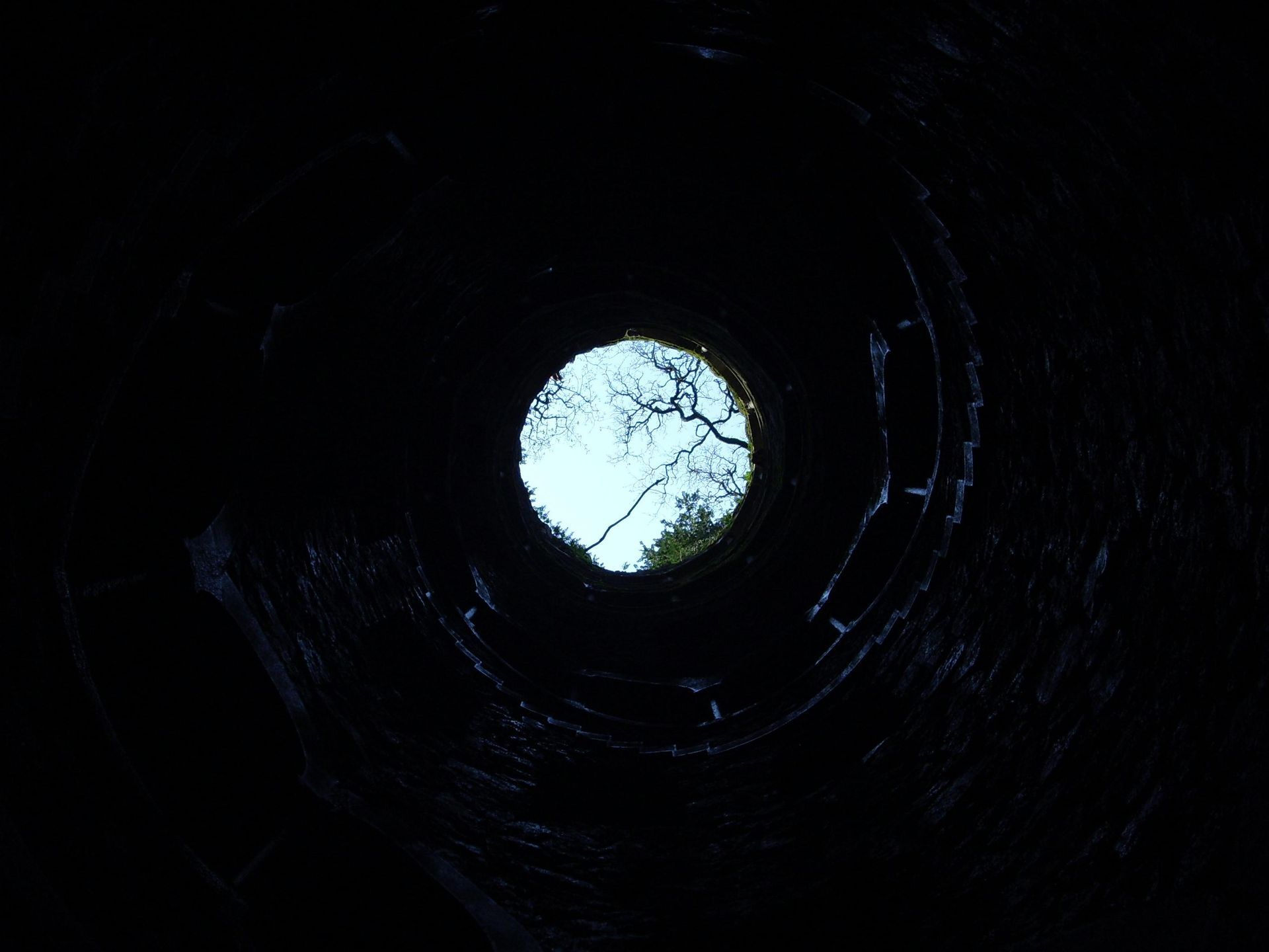 View looking straight up from the inside of a well