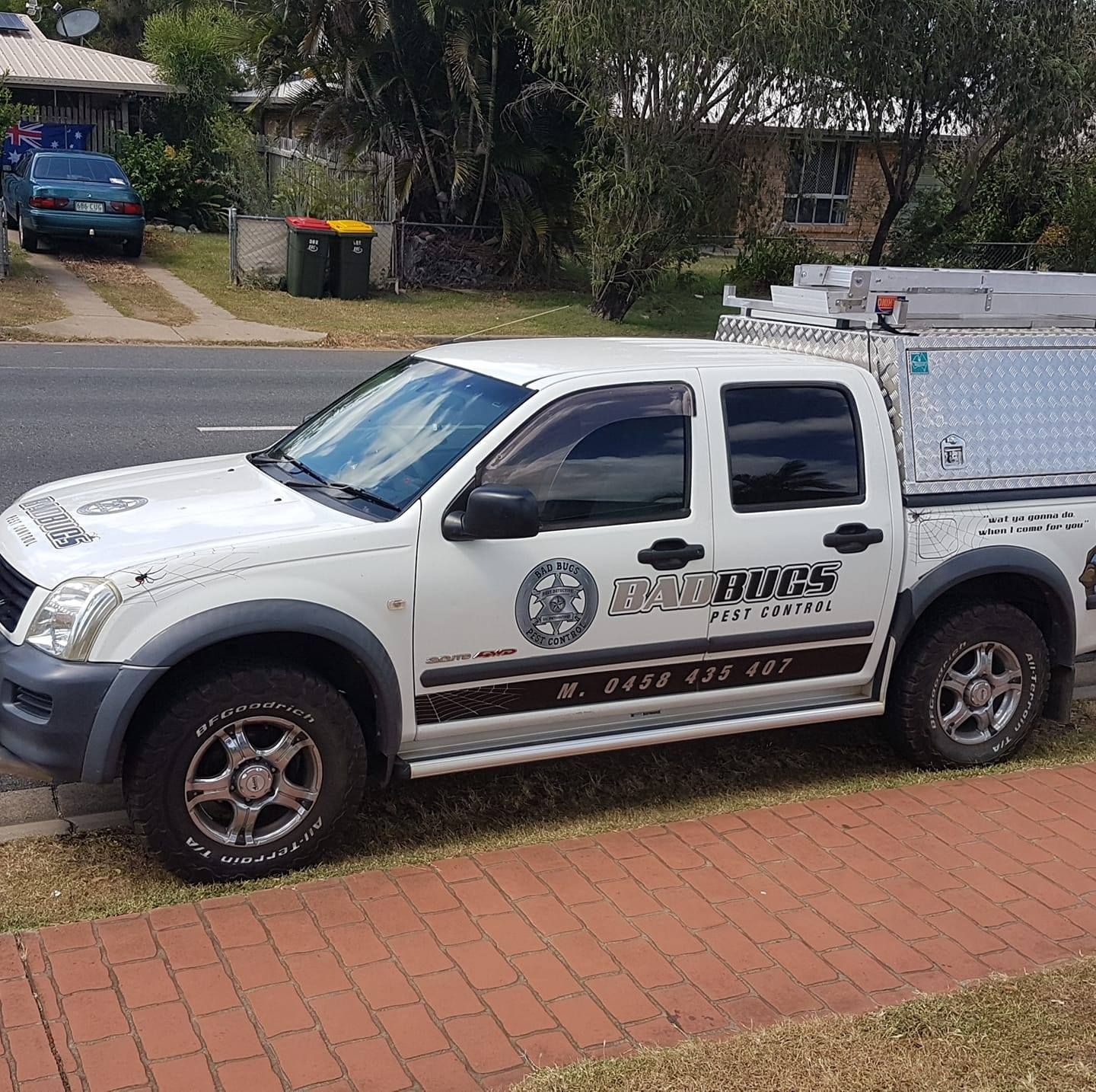 White Work Truck Parked on A Curb — Bad Bugs Pest Control in Rockhampton, QLD