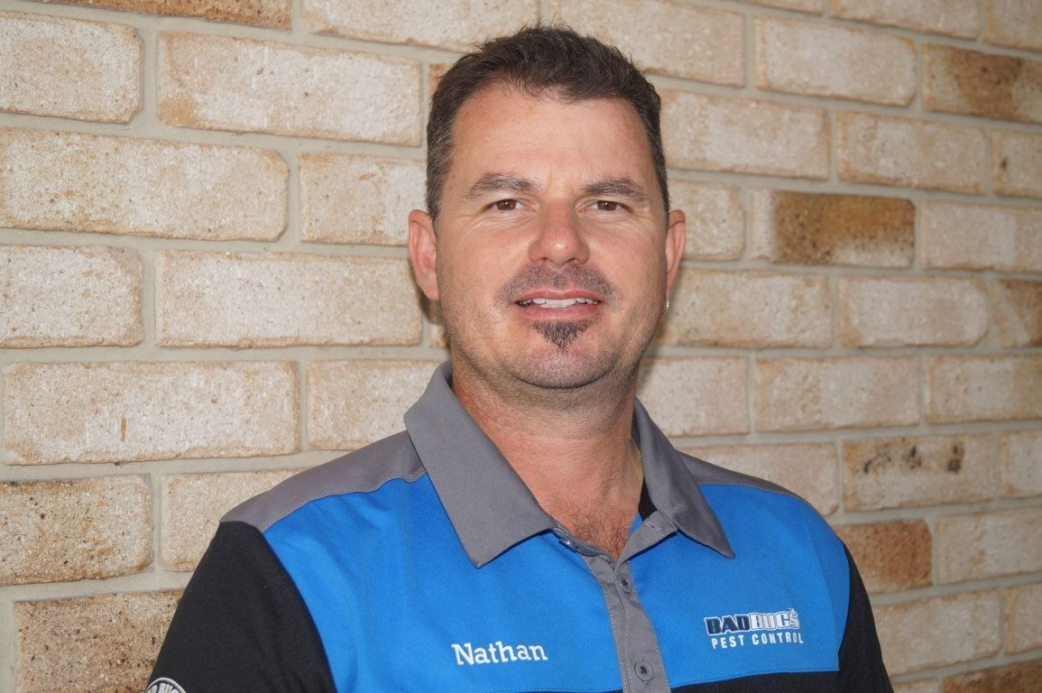 Man With Short Brown Hair and Goatee Wearing a Blue and Grey Collared Shirt — Bad Bugs Pest Control in Rockhampton, QLD