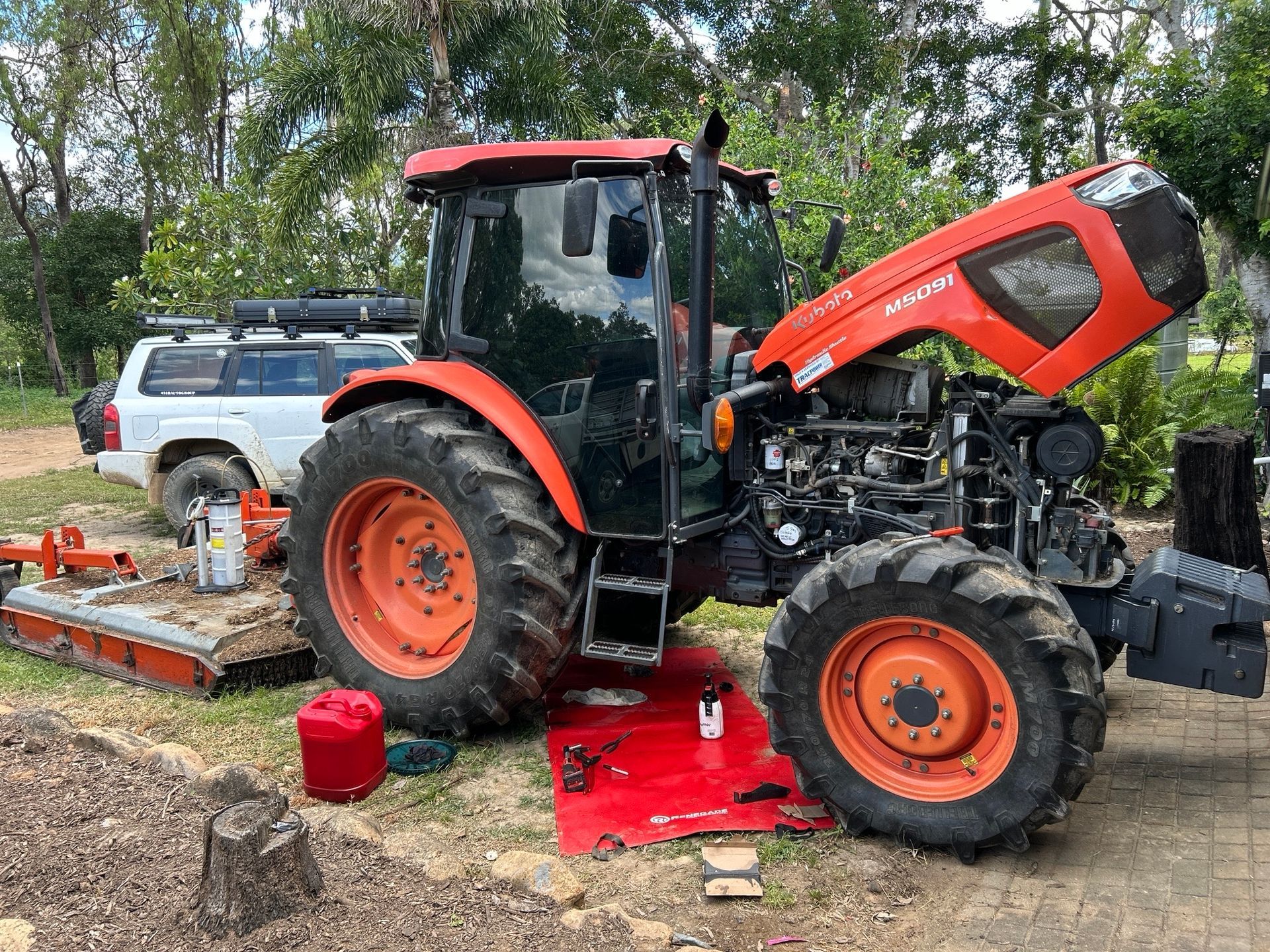 A Yellow Machine in a dirt yard — I & J Mechanical in Deeragun, QLD