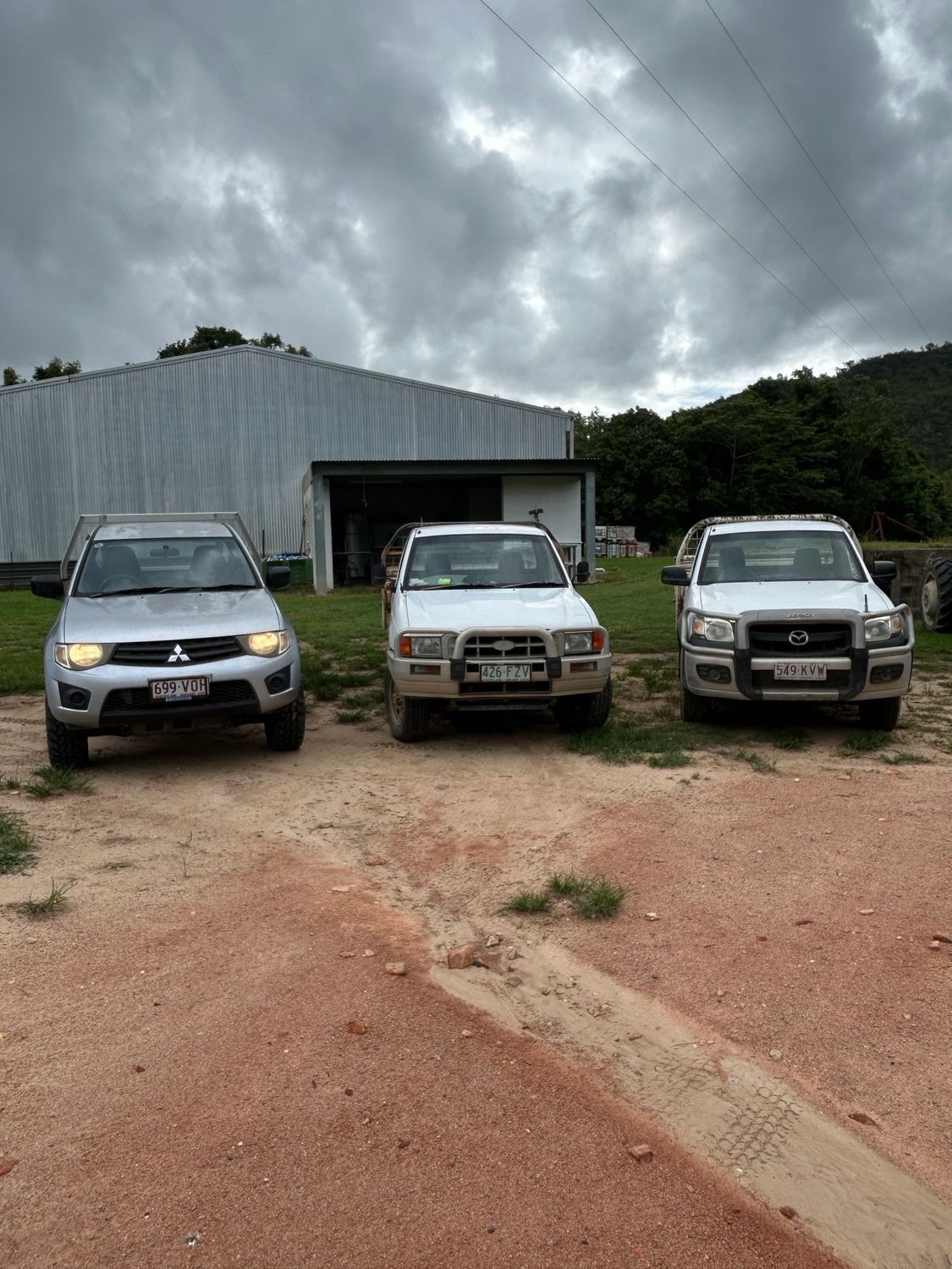 Person Using a Tool to Remove a Car Tail Light — I & J Mechanical in Deeragun, QLD