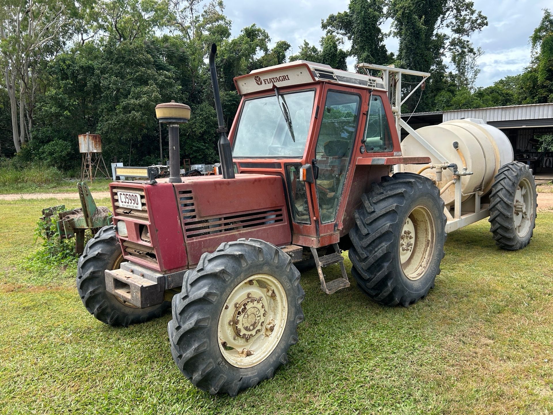 Work ute is Parked Next to a Yellow and Black machine — I & J Mechanical in Deeragun, QLD