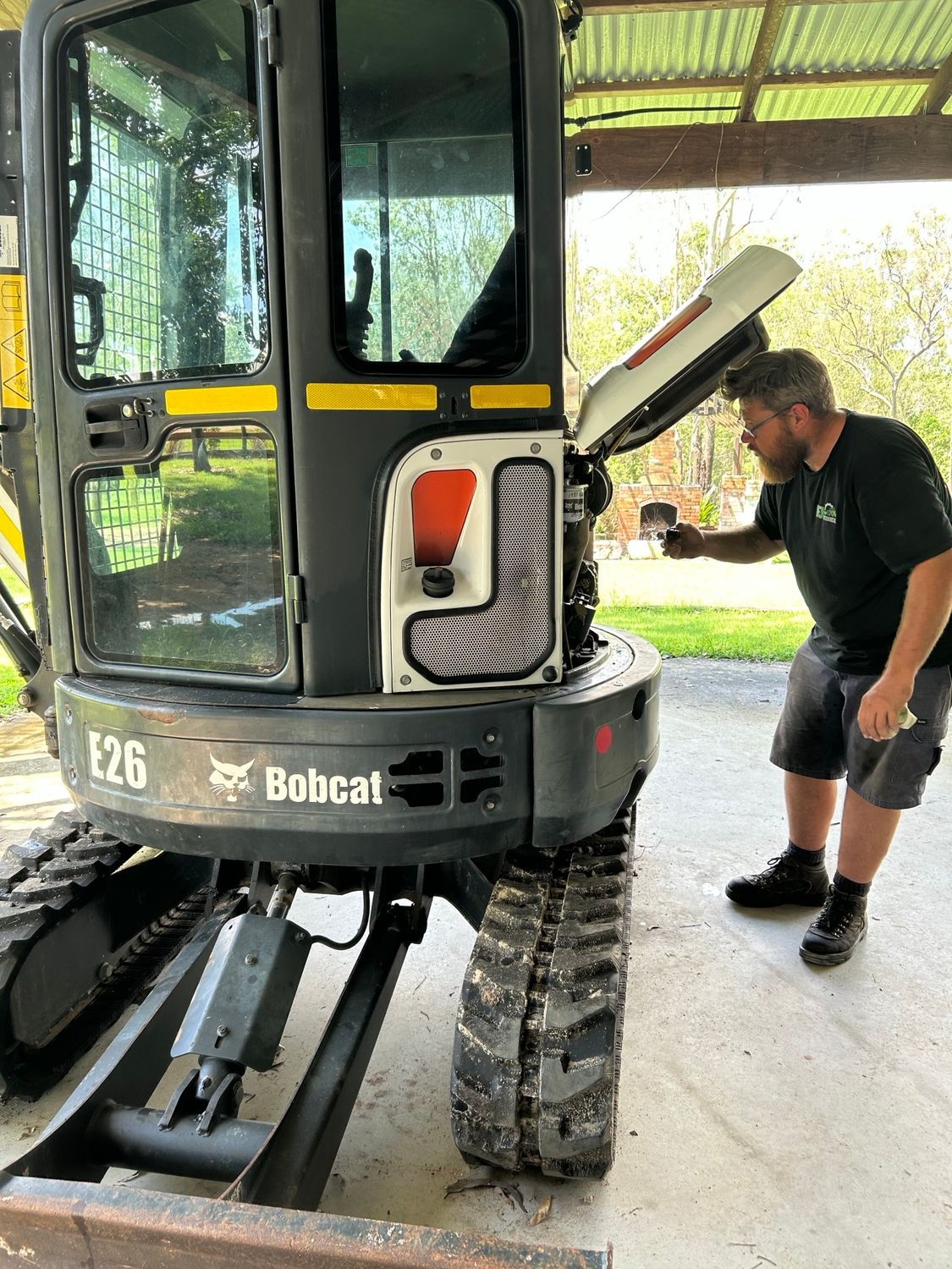 Yellow Mini Excavator With Black Seat — I & J Mechanical in Deeragun, QLD