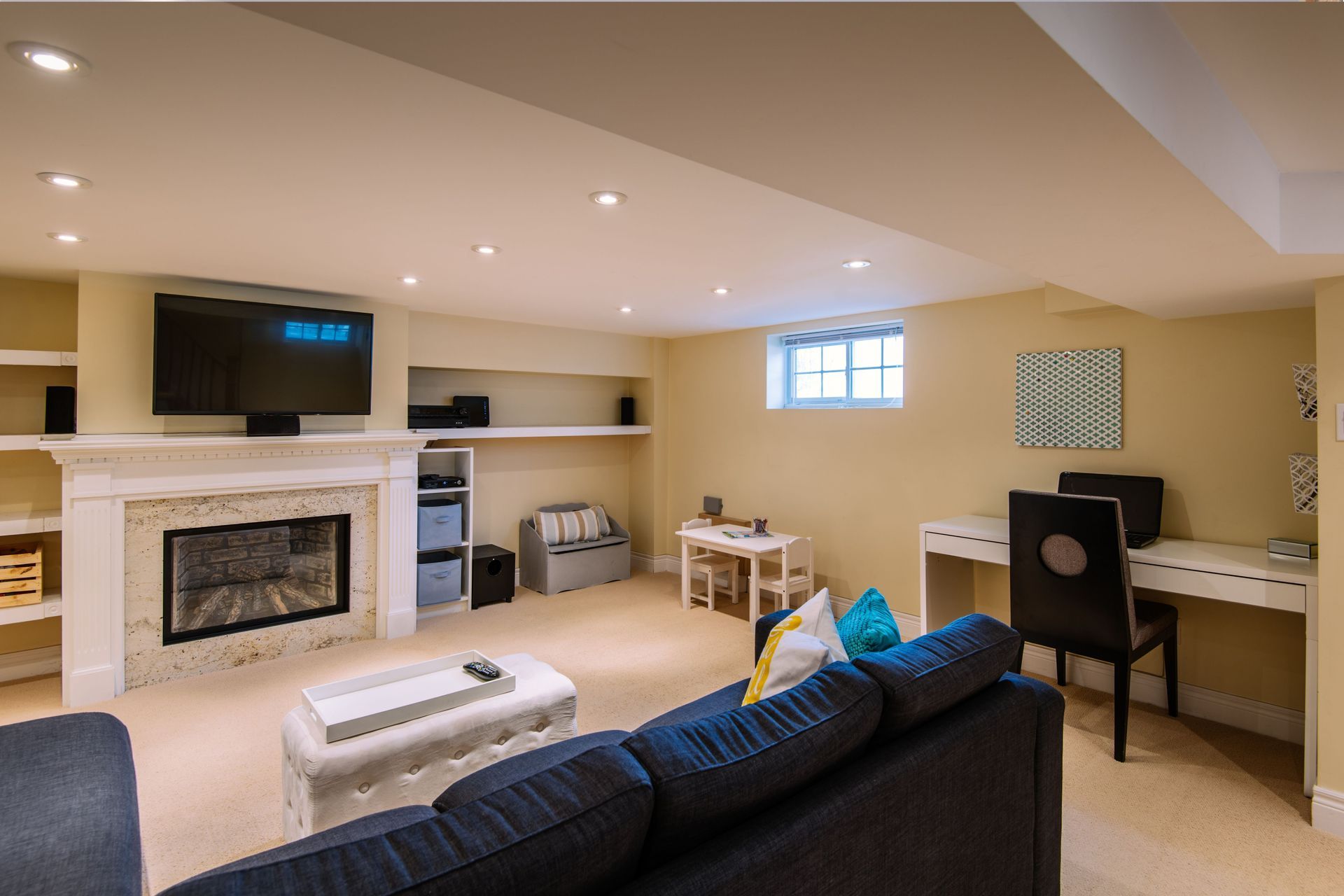 A living room with a couch and a fireplace
