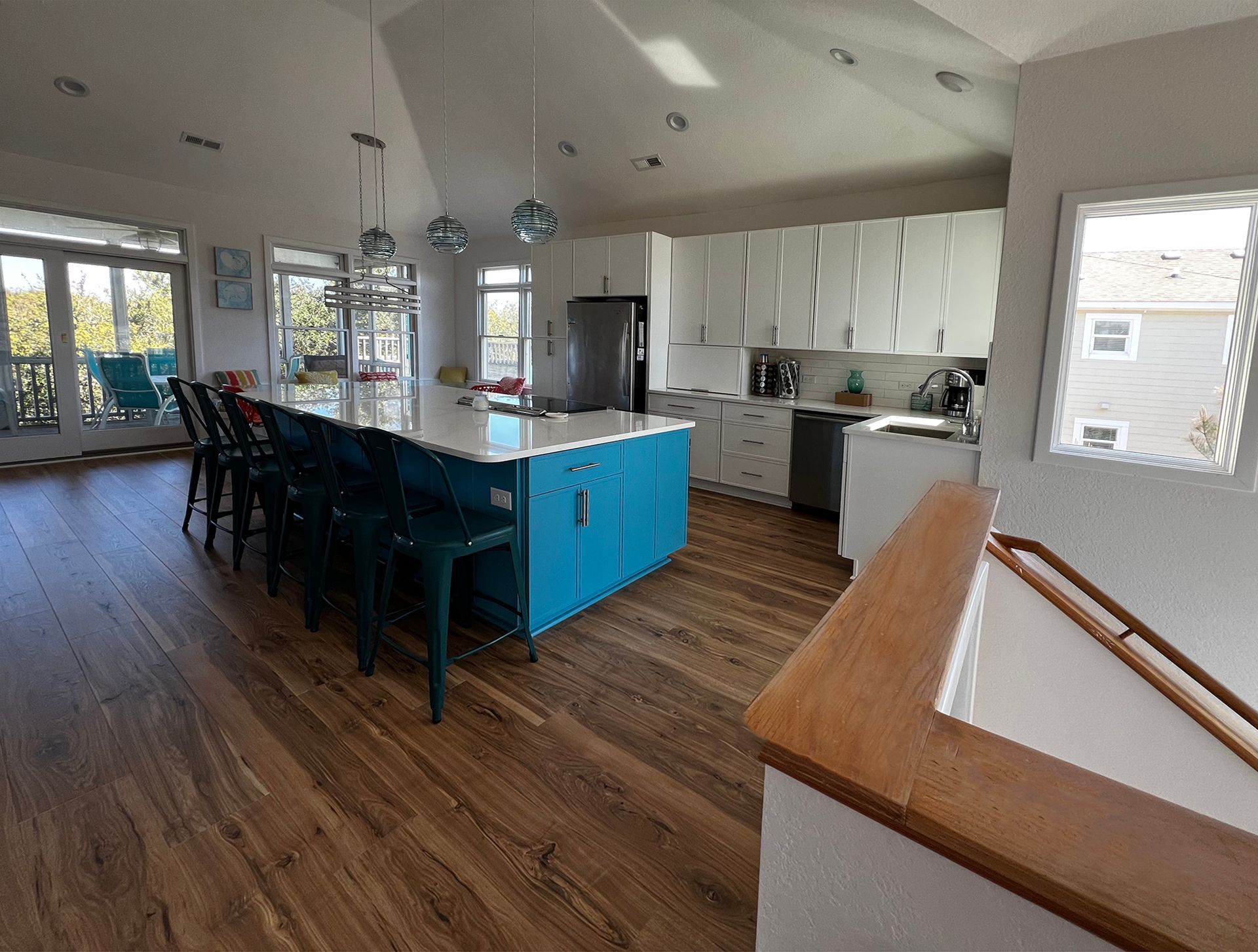 A newly renovated Kitchen with counters in granite and white cabinets