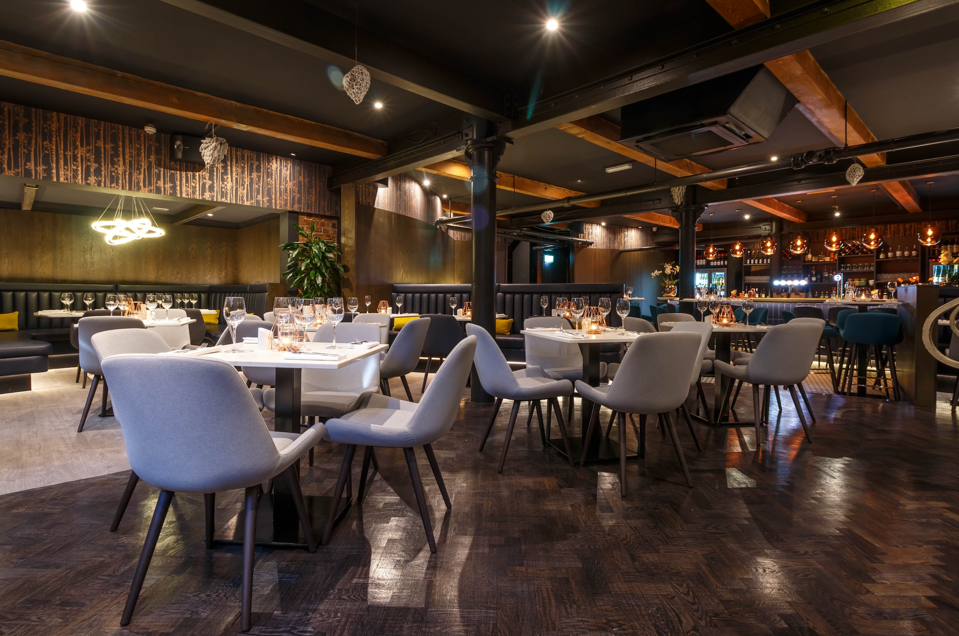 A large dining room with tables and chairs in a restaurant.