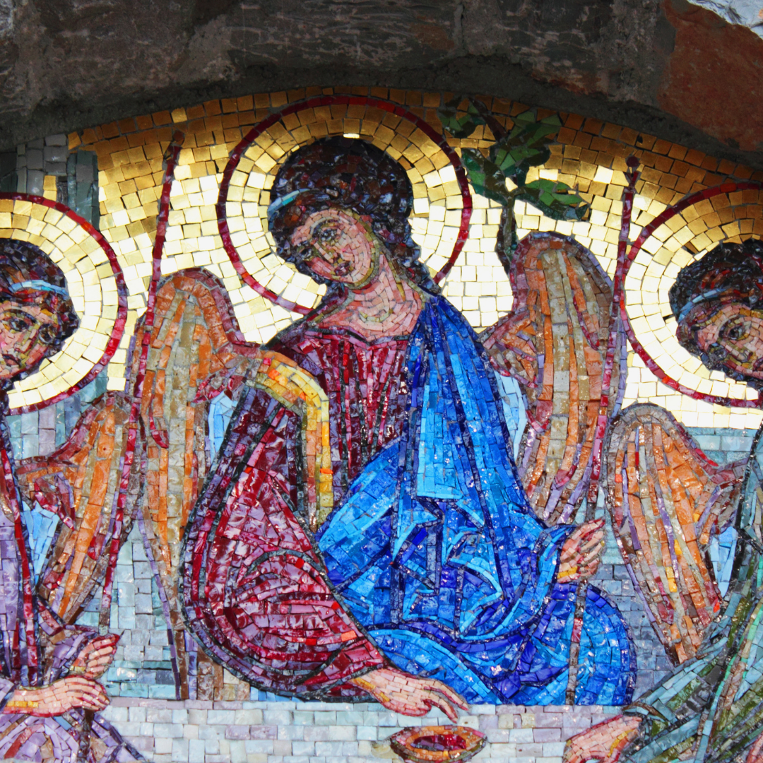Mosaic of angels, central one in blue robe holding olive branch. Gold halos, ornate backdrop.