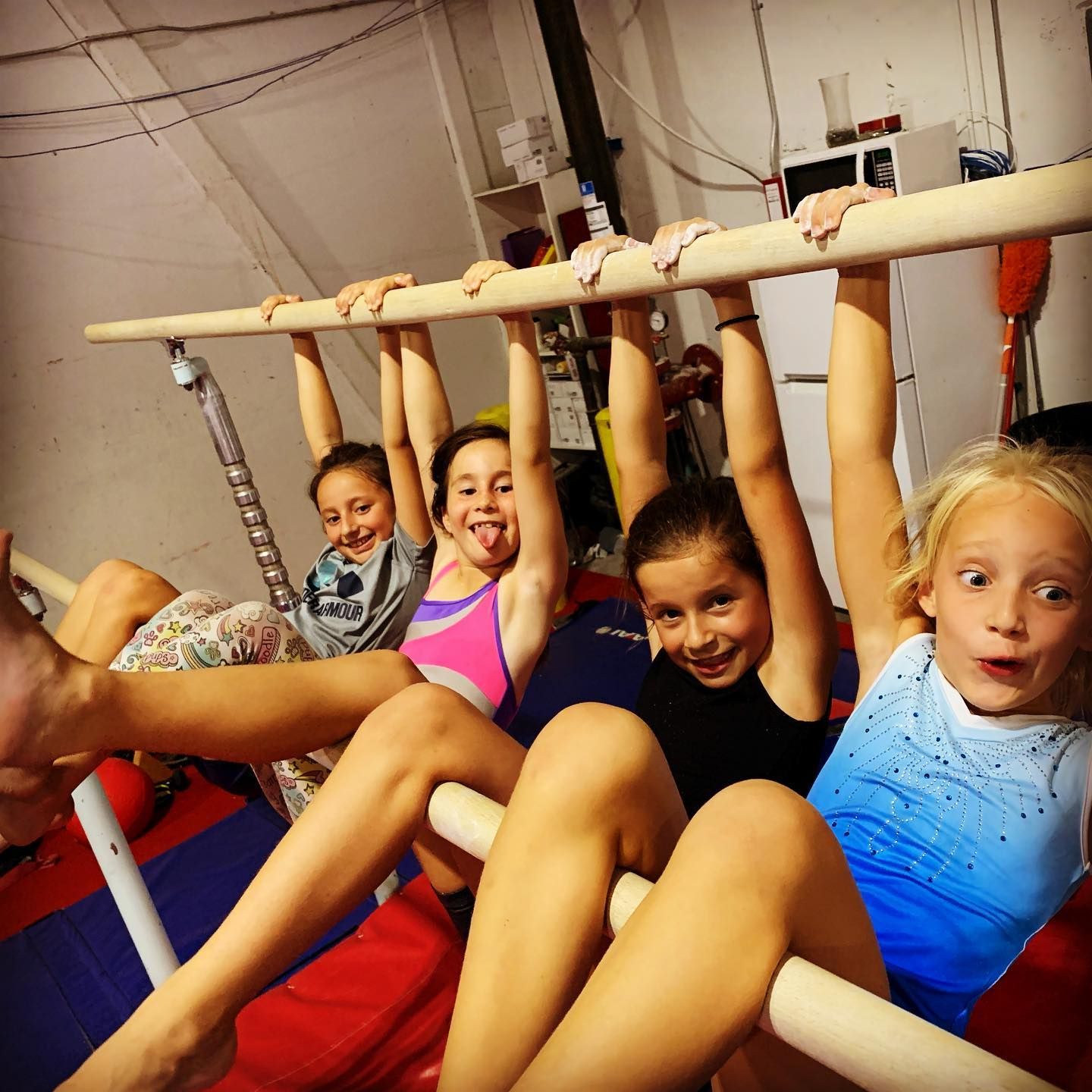 A person is holding two gymnastic rings in their hands.