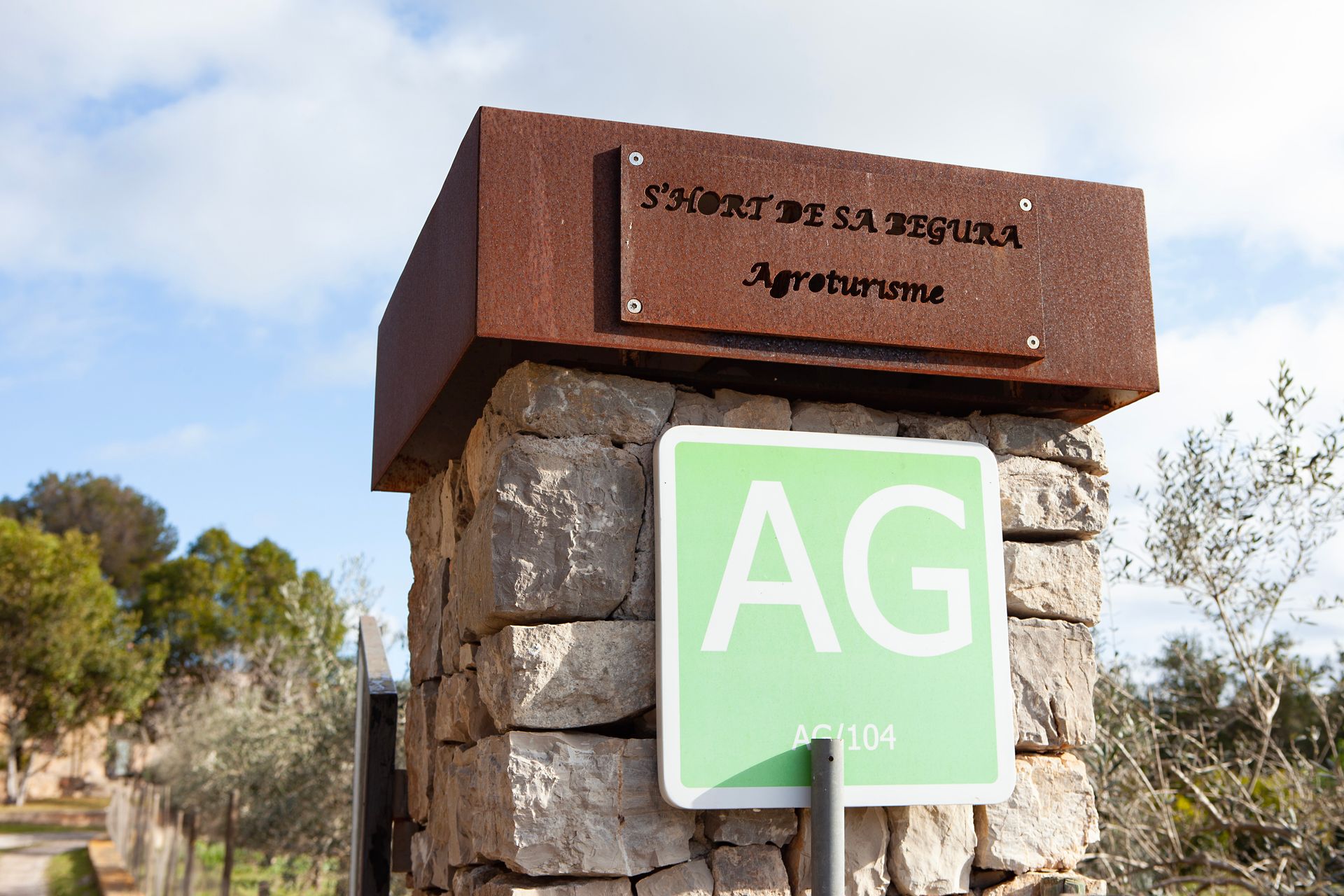 A green and white sign that says ag on it