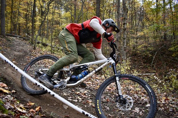 mountain bike rider in the woods, low angle, speed