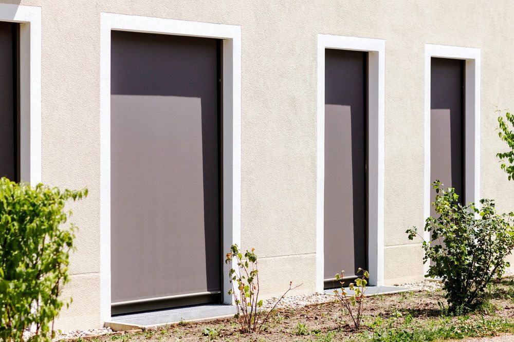 Large Row Of Windows With Light Brown Blinds — Window Coverings in Gold Coast, QLD