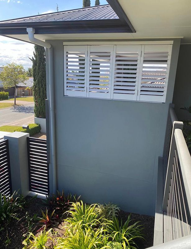 House Adorned with White Shutters on Its Side — Shutters in Gold Coast, QLD