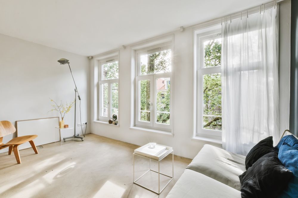 Inviting Living Room with Couch, Chair, Curtain, and Table — Window Coverings in Gold Coast, QLD
