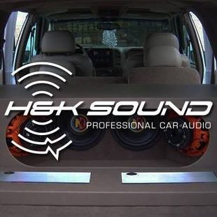 Car trunk-mounted subwoofer box with large &ldquo;HexSound&rdquo; and &ldquo;Professional Car Audio&rdquo; branding, viewed from the rear.