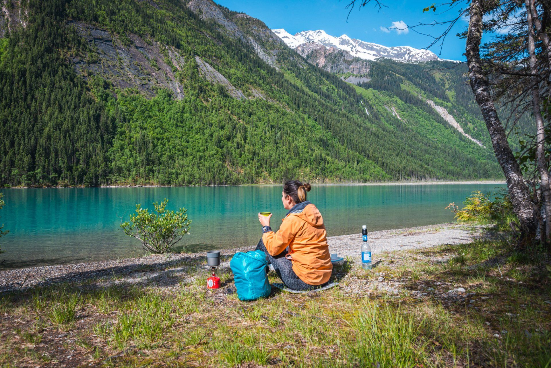 Kinney lake side breakfast. mt Robson park, BC, Canada. Turquoise lake and mountains touched with first rays of morning sun