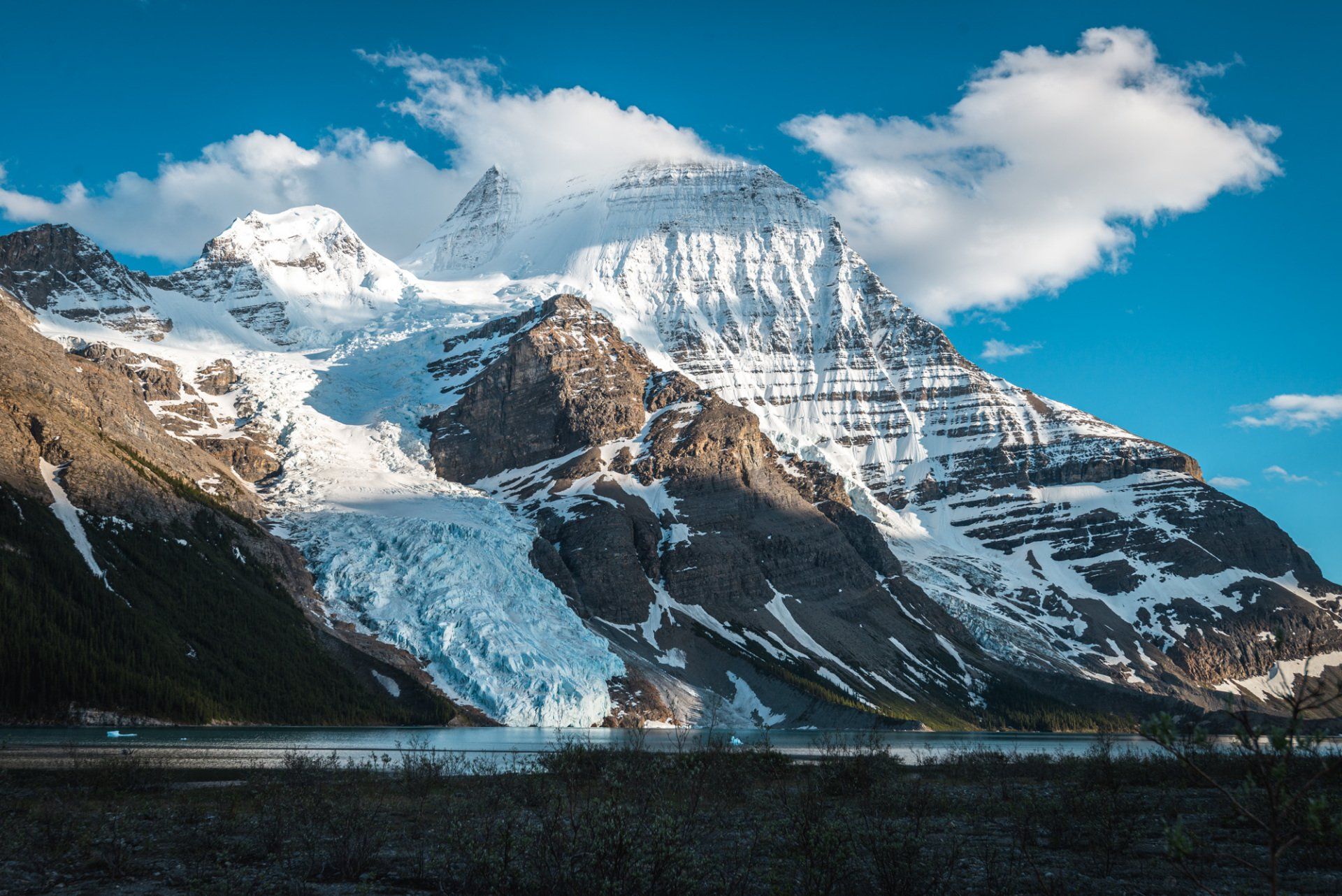 Sunset on Berg lake, mt Robson park, BC, Canada. Turquoise lake and mountains touched with first rays of morning sun