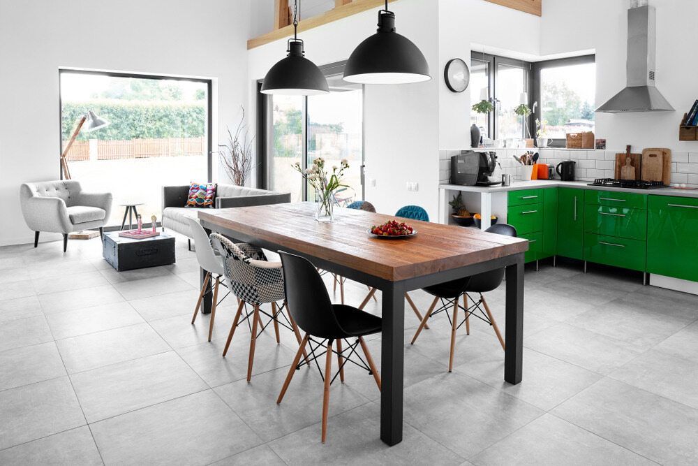 A Kitchen With Green Cabinets and a Wooden Table and Chairs — Anton's New & Used Furniture In Ciccone, NT