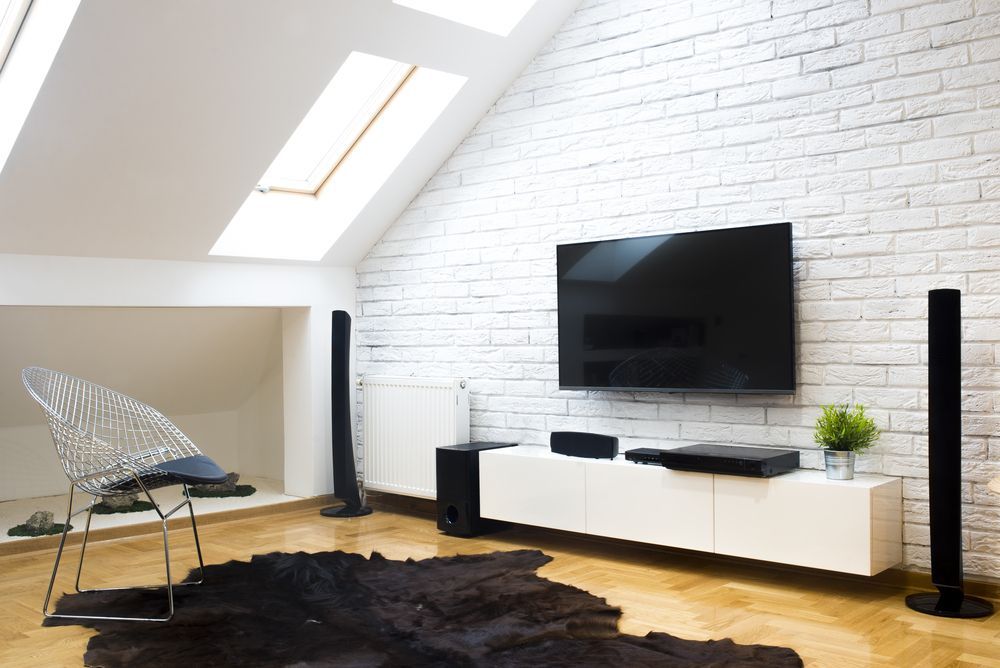 A Living Room With a Flat Screen Tv Mounted on the Wall  — Anton's New & Used Furniture In Ciccone, NT