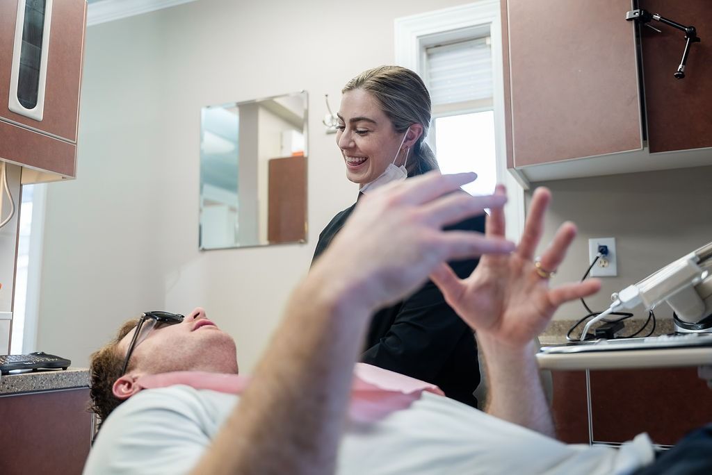 Patient and clinician talking in a medical exam room