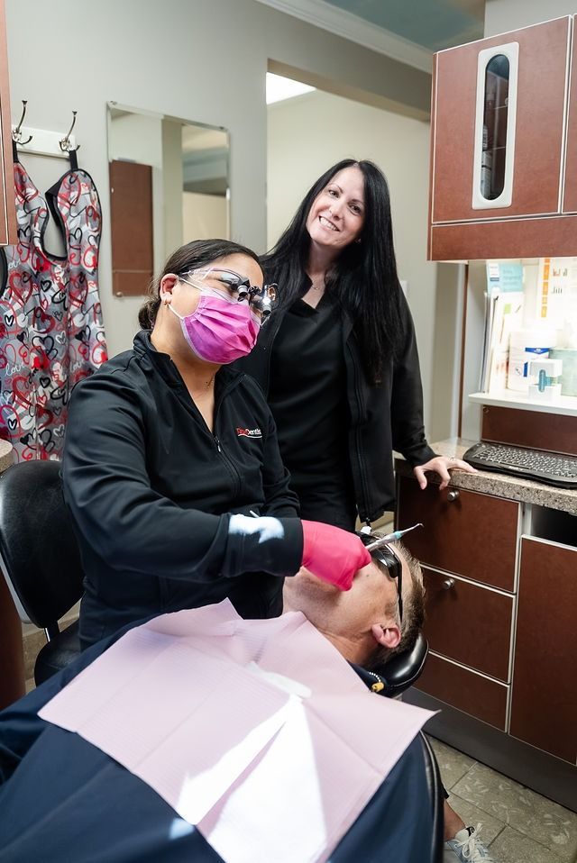 Hairdresser working on a client’s hair in a salon