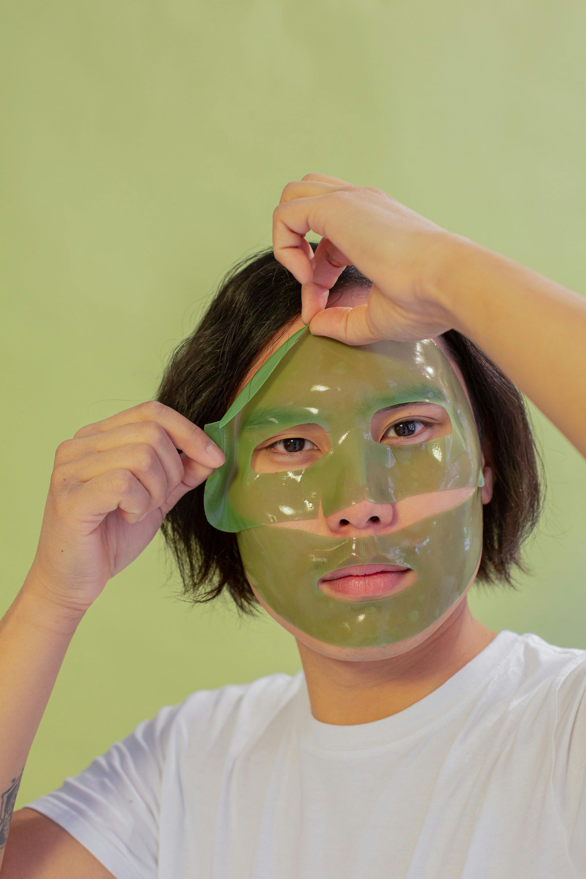 Man applying a customized facial mask designed to hydrate, soothe, and revitalize the skin.
