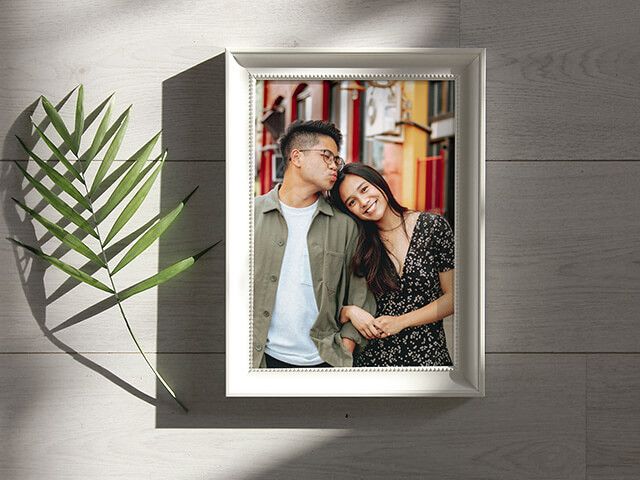 A picture of a man and woman standing next to each other in a frame.