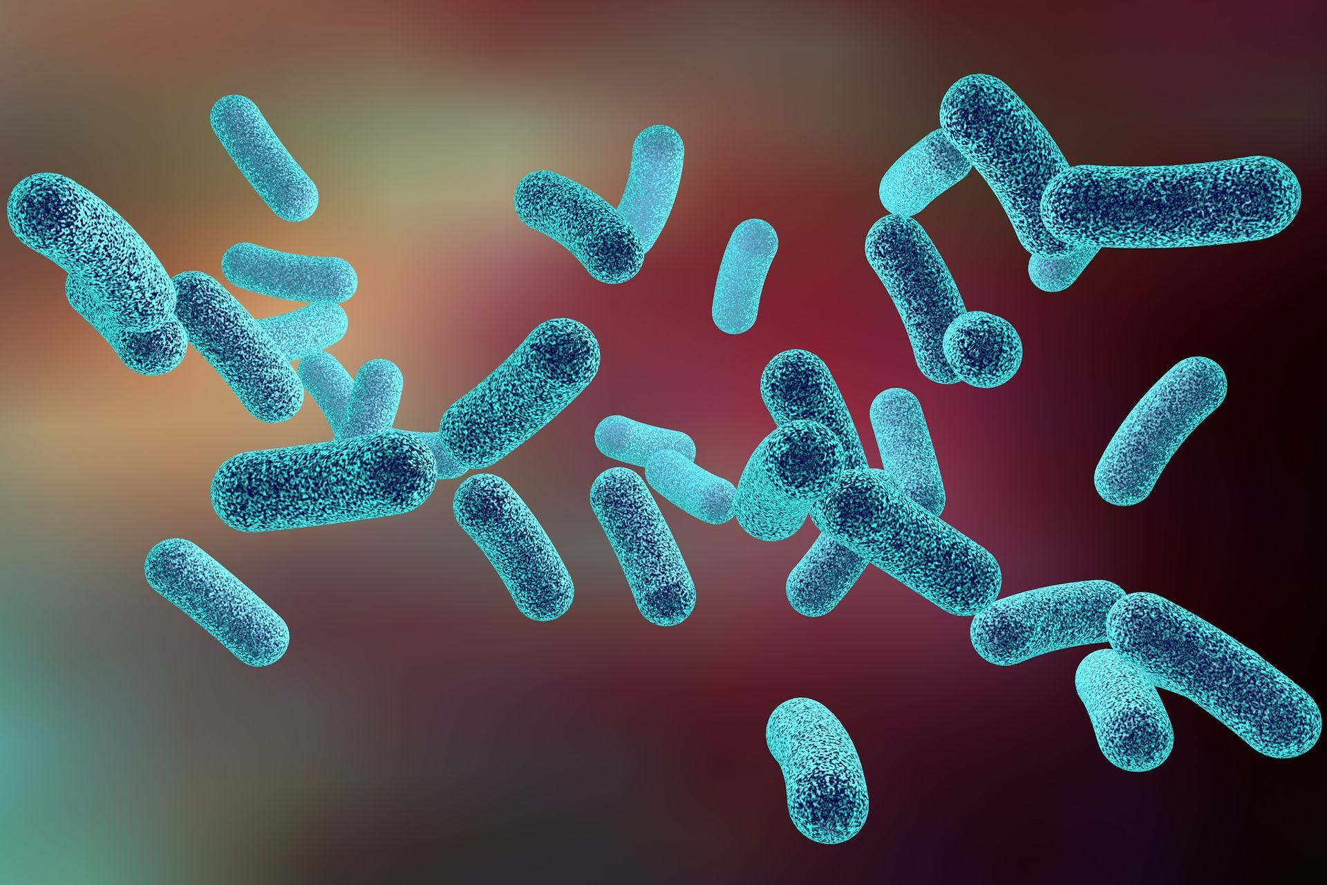 Cromosomi blu a forma di X su uno sfondo multicolore sfocato.