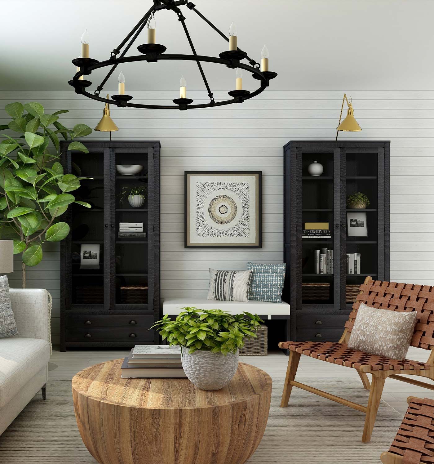 Living room with black bookshelves, round wooden table, and leather chair under a chandelier.