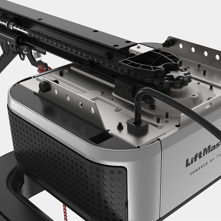 Close-up of a LiftMaster garage door opener mechanism with a black chain and metal components.
