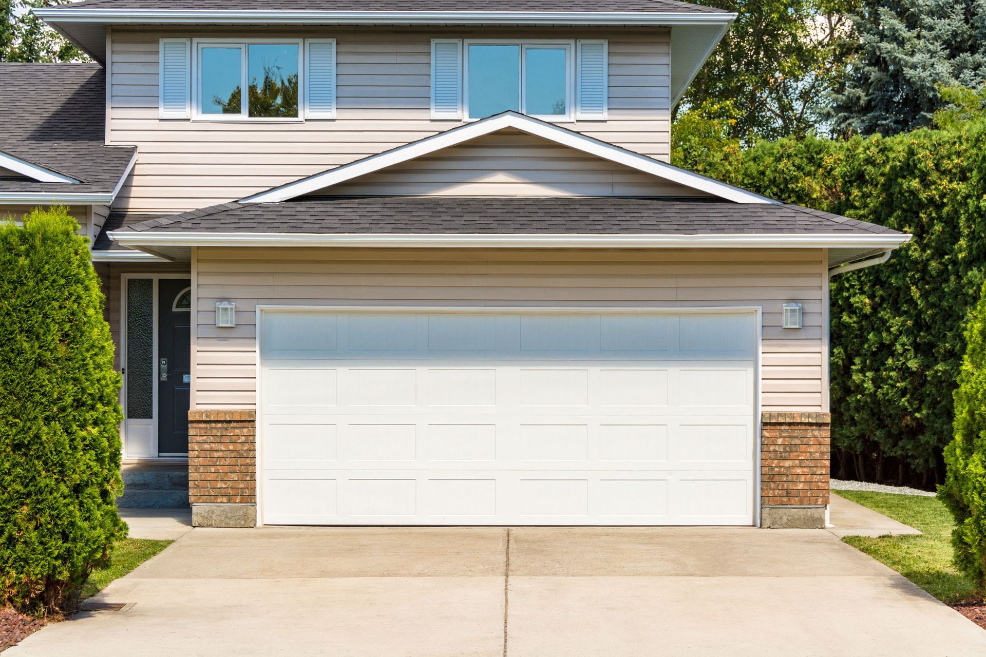 Wide garage door of residential house. Wide garage door of residential house.