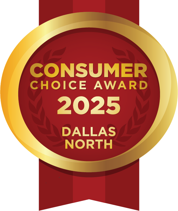 A gold-rimmed red badge with the text