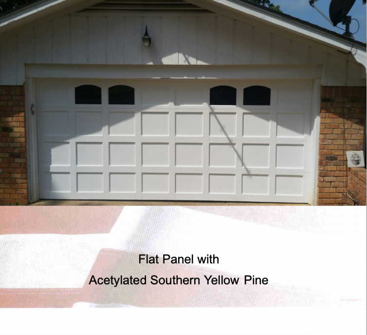 A white, panelled residential garage door with top windows, labeled as 