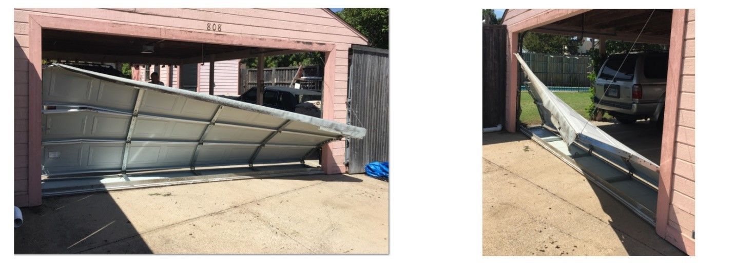 Damaged carport garage door, bent and fallen. Outdoors, daylight.