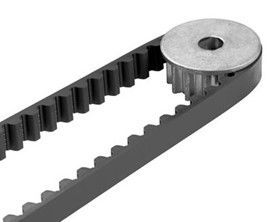 Black toothed timing belt wrapped around a silver pulley. Black toothed timing belt wrapped around a silver pulley.