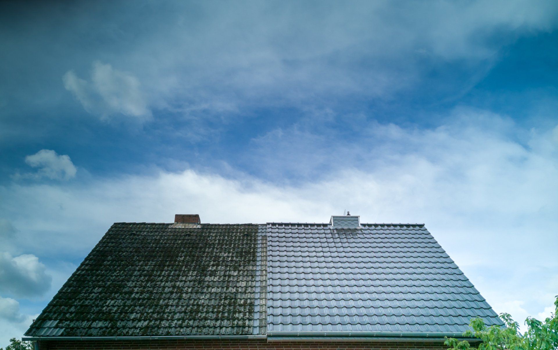 image of man power washing brick patio