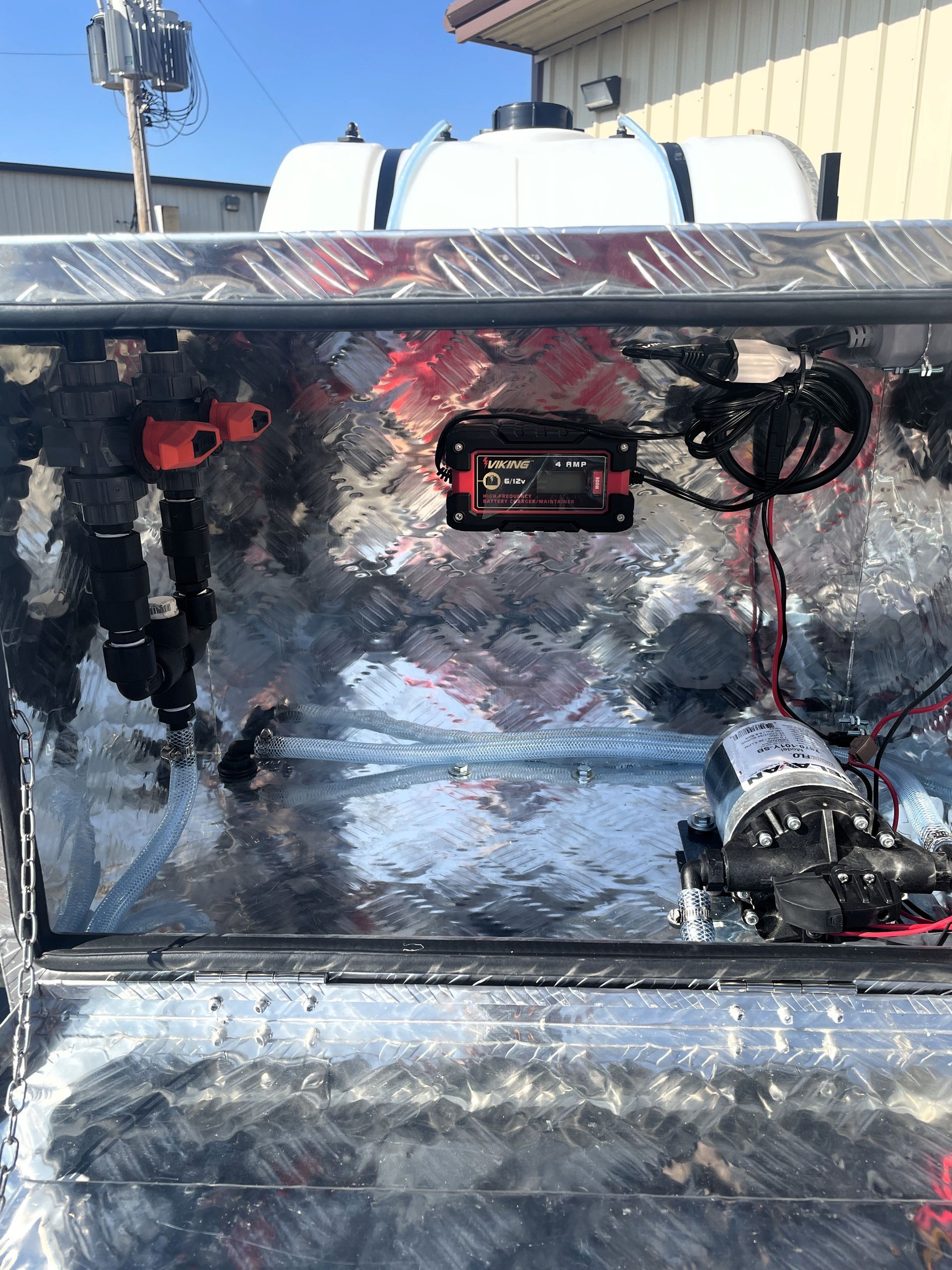A close up of a metal box with a lot of wires coming out of it.