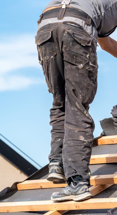 Roof Replacement in Florence, OR - roofer installing roof tiles